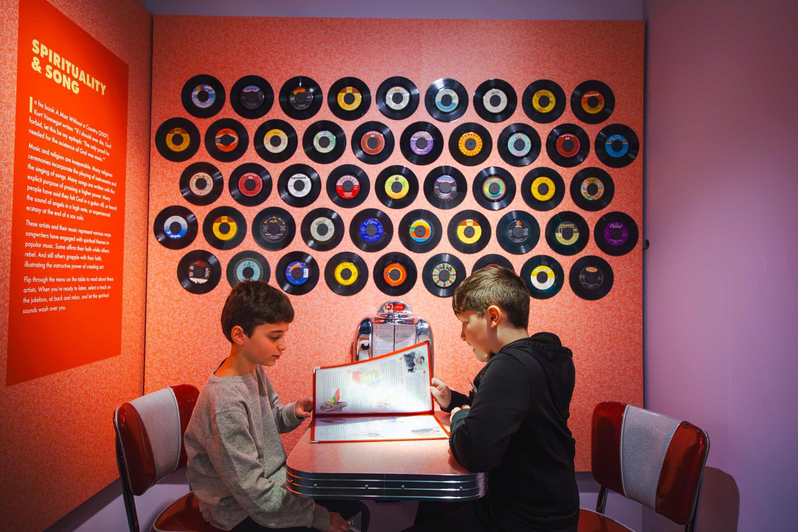 Visitors exploring immersive exhibit space